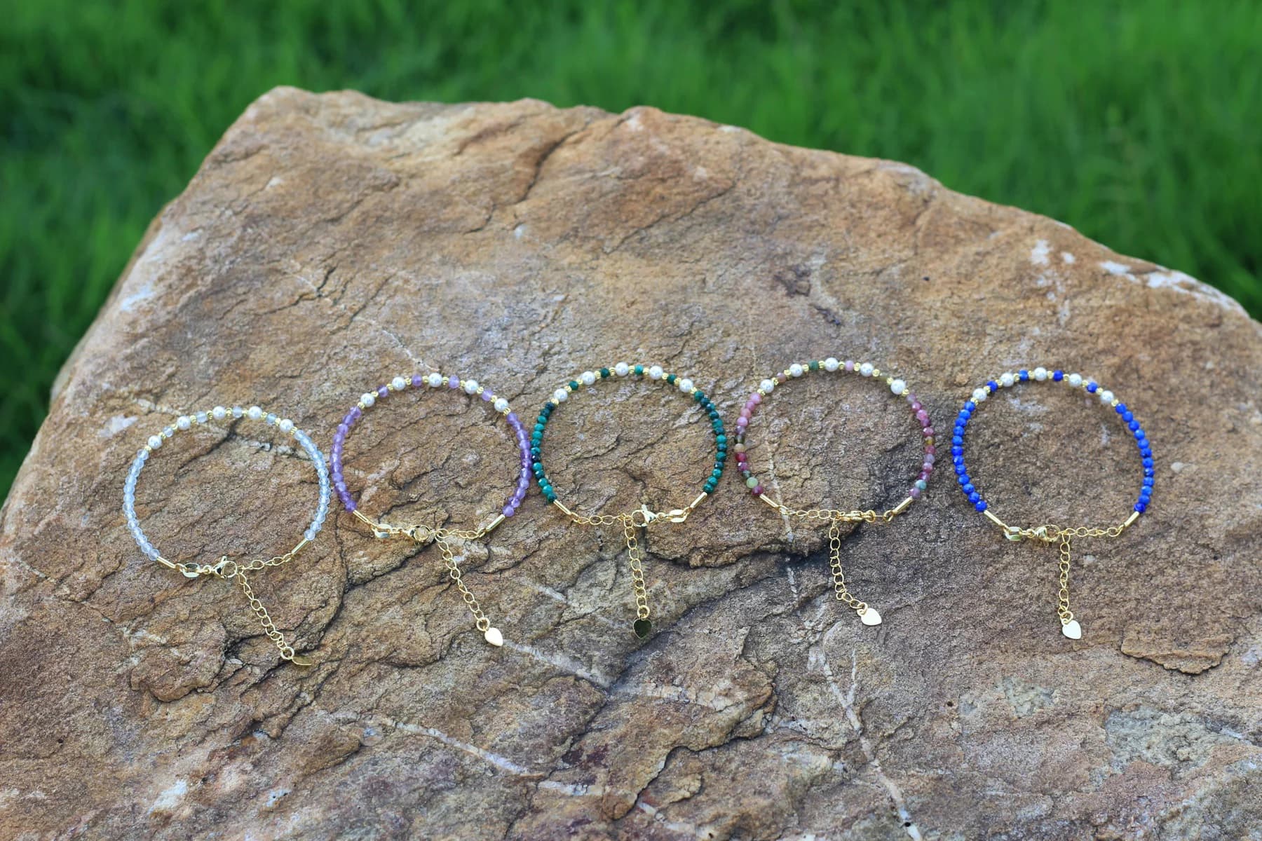 Five Crystal Houzz adjustable gemstone bracelets with mother-of-pearl shell beads and gold-tone chains